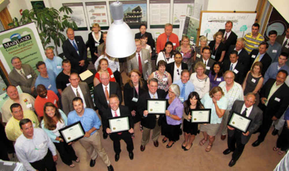 Group of people stand around the winners of the Green Registry Award